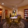 Wellness area of a hotel with table, chairs and loungers.