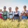 The Hopfeld family in traditional costume in a field.