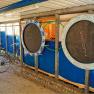 Bicycle garage with trampolines on the wall.